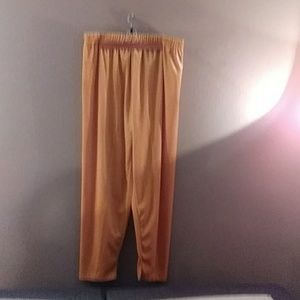 Women's gold-colored elastic waist knitted pants.